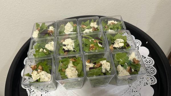 Beets salad w arugula, cheese and candied nuts platter. Party Food Platters. Los Angeles Catering Service.